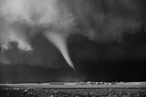 White tornado above farm